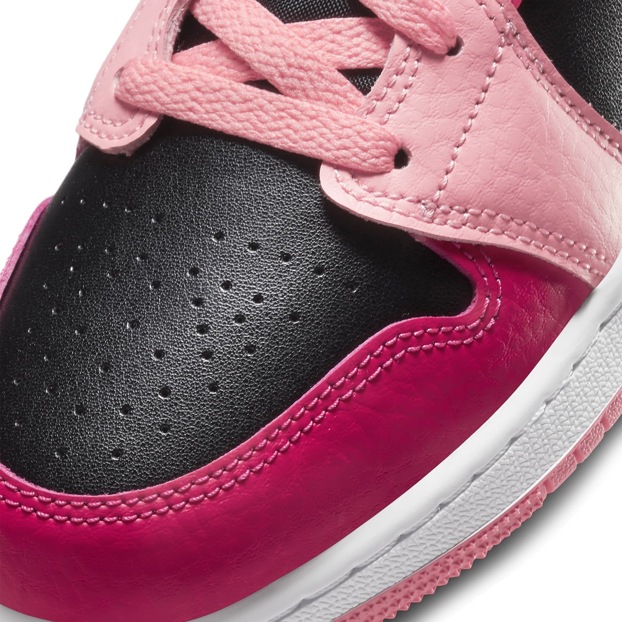 Toe box view of Air Jordan 1 Mid Coral Chalk (GS) 554725-662